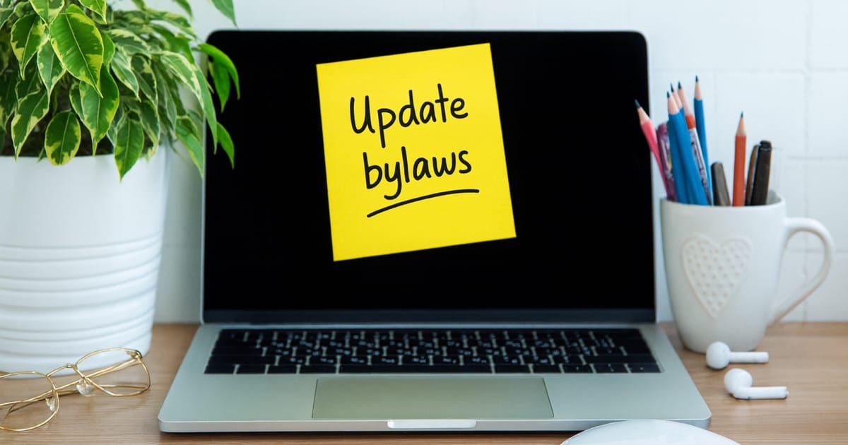 A laptop open to a bylaws document